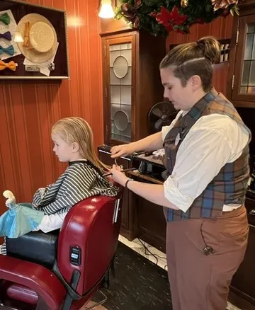 Trimming child's hair at Harmony Barber Shop