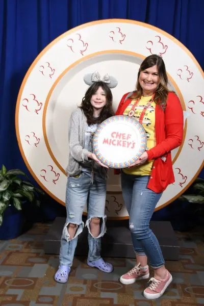 Ellen and her child at Chef Mickey's