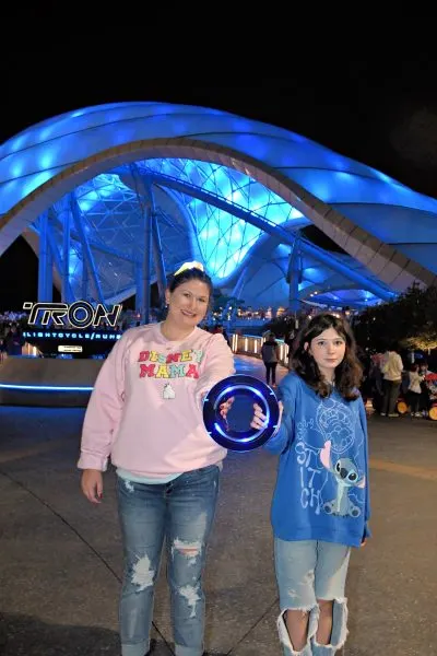 Ellen and child in front of TRON
