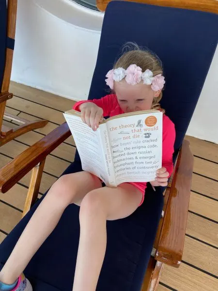 Erin's daughter reading and relaxing