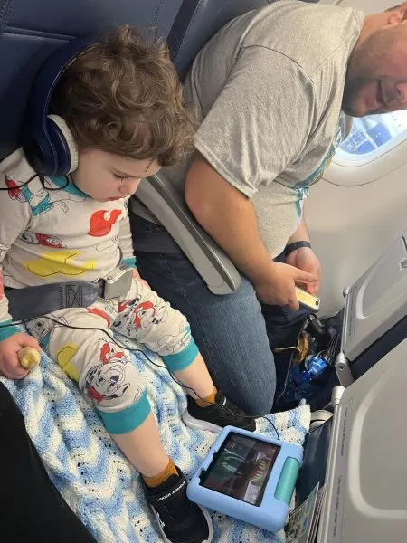 Jackie's toddler on a plane