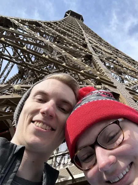 Maria and her husband at the Eiffel Tower