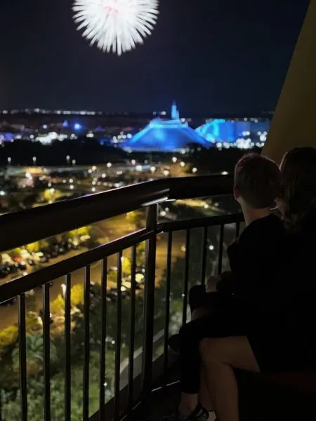 Liz's son watching the fireworks from the balcony