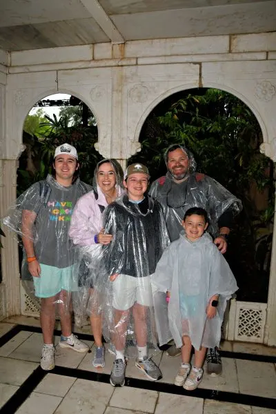 Mary Lanier’s family in ponchos at the bus stop