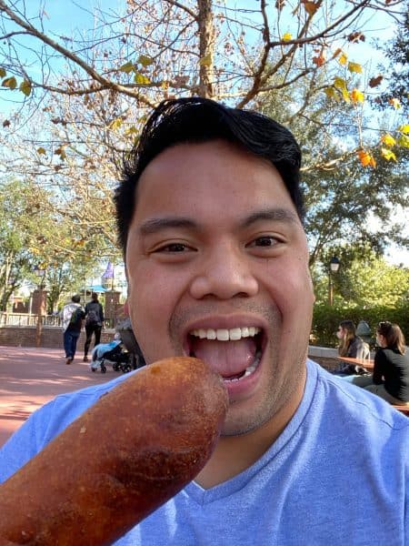 anthony with a corn dog WDW Prep to Go Podcast
