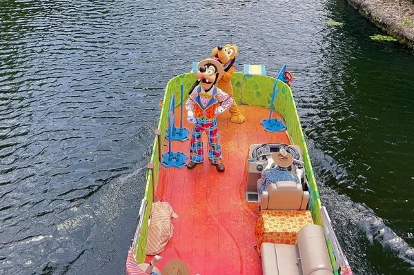 goofy and pluto on dino-bash flotilla at animal kingdom