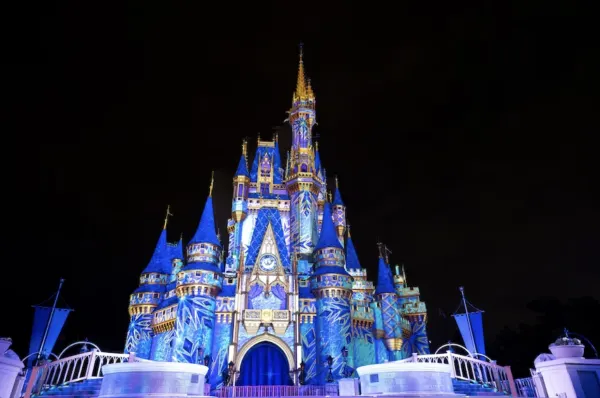 a frozen holiday surprise projection on cinderella castle
