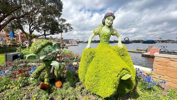 snow white and dopey toparies at epcot flower and garden