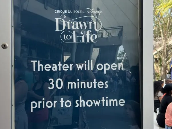 Sign announcing theater opening time 2024