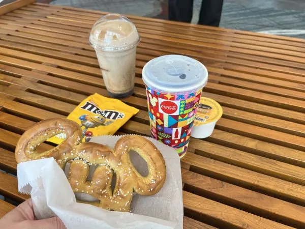 Mickey pretzel with cheese, Diet Coke, peanut M&Ms, and frozen Coke
