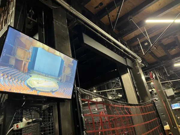 The heavy duty lift and monitor of stage as seen from backstage Drawn to Life 2024