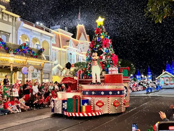 minnie and mickey on float during mickey's once upon a christmastime parade