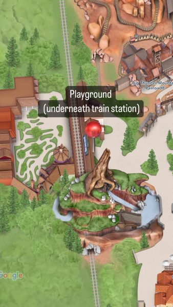 location of playground in frontierland underneath the train station