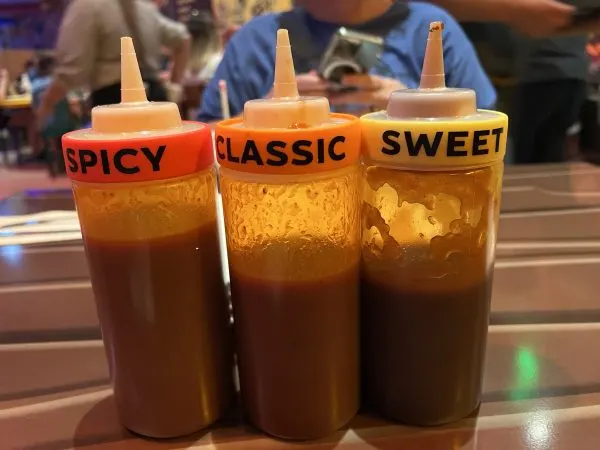 spicy classic and sweet sauces on table at roundup rodeo bbq