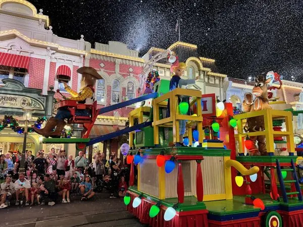 toy story float with woody, bo peep and bullseye during mickey's once upon a christmastime parade